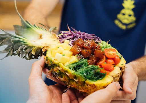 iconic poke bowl inside a Pineapple, or piña